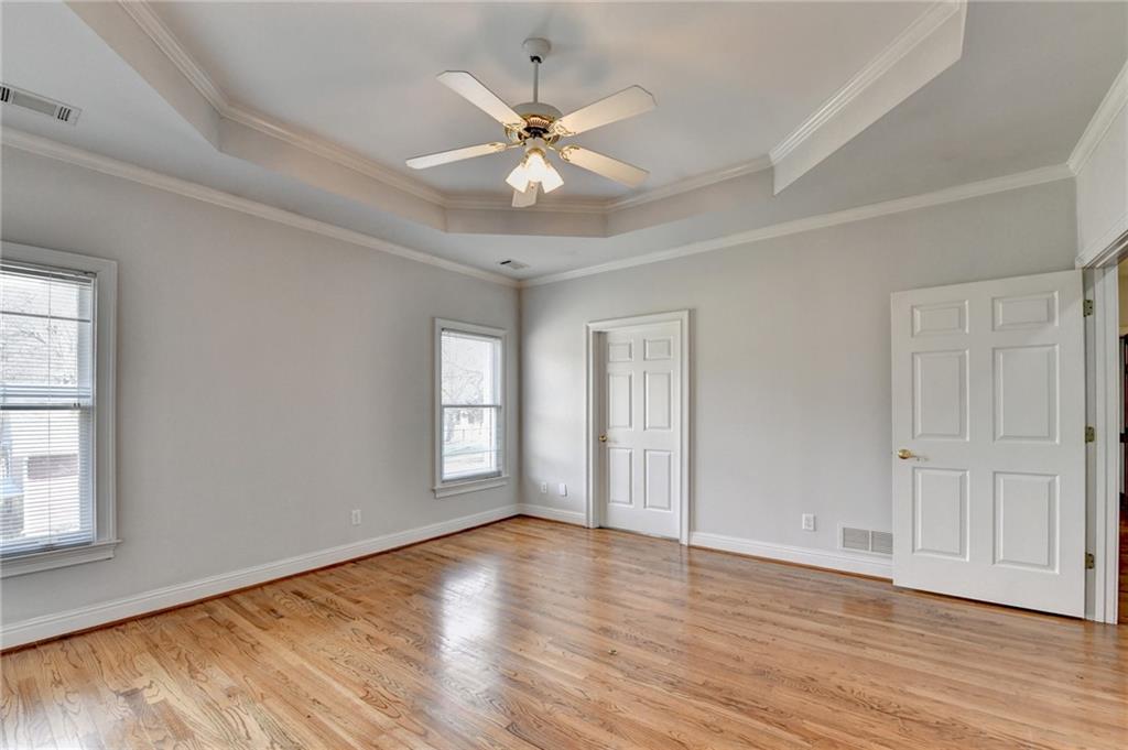 1622 New Hope Road Lawrenceville, GA 30045 - Photo 47 of 110 a view of an empty room with wooden floor and a window