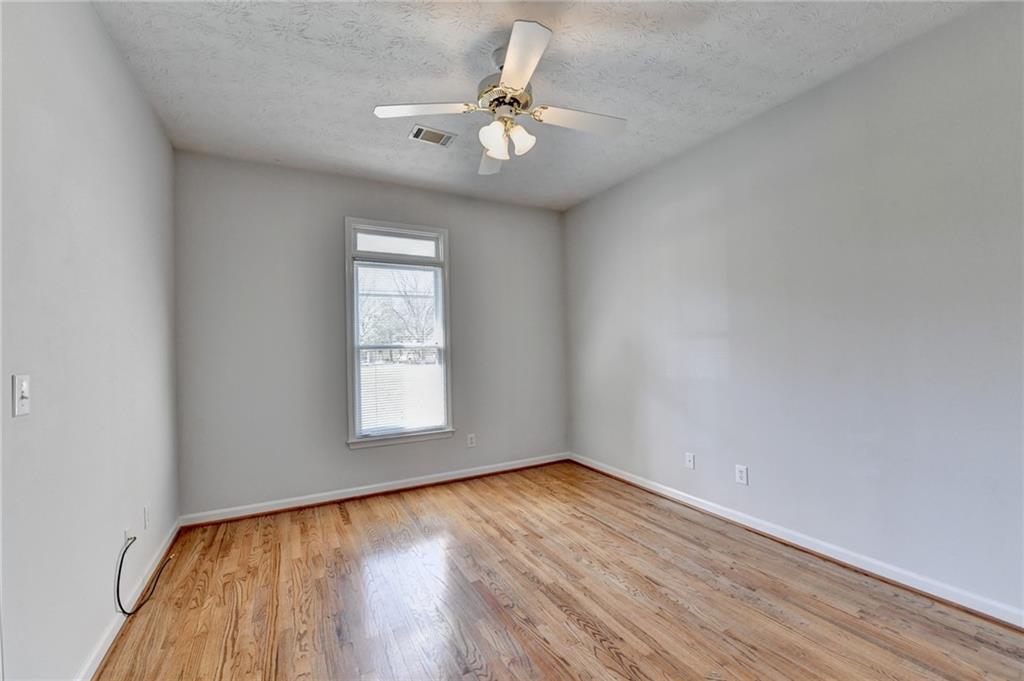 1622 New Hope Road Lawrenceville, GA 30045 - Photo 54 of 110 wooden floor in an empty room with a window