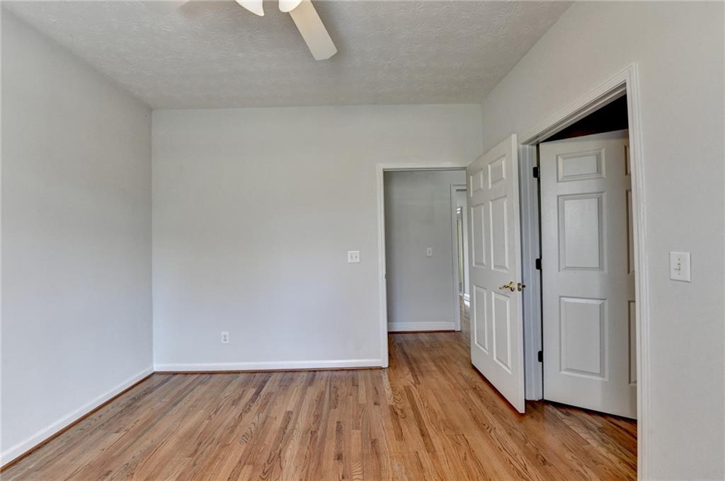 1622 New Hope Road Lawrenceville, GA 30045 - Photo 56 of 110 a view of an empty room and wooden floor