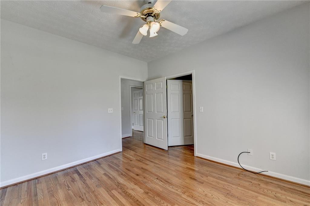 1622 New Hope Road Lawrenceville, GA 30045 - Photo 57 of 110 a view of an empty room with wooden floor