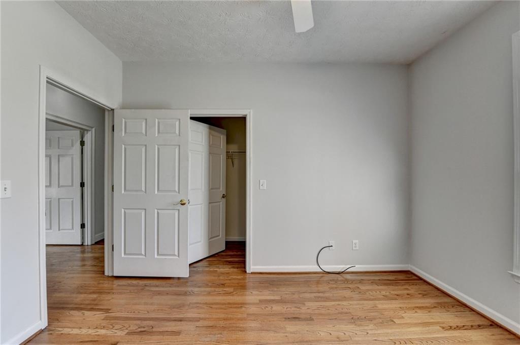 1622 New Hope Road Lawrenceville, GA 30045 - Photo 58 of 110 a view of an empty room with wooden floor and closet