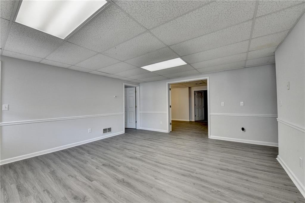 1622 New Hope Road Lawrenceville, GA 30045 - Photo 59 of 110 a view of an empty room with wooden floor and closet