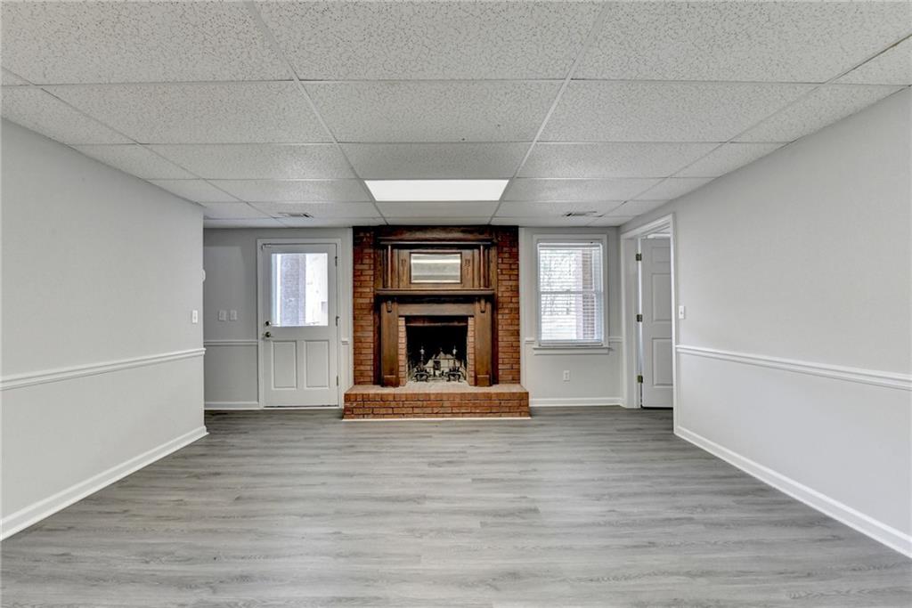 1622 New Hope Road Lawrenceville, GA 30045 - Photo 61 of 110 a view of an empty room with a fireplace and a window