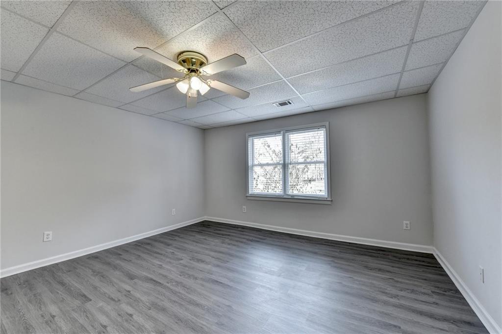 1622 New Hope Road Lawrenceville, GA 30045 - Photo 68 of 110 wooden floor in an empty room with a window