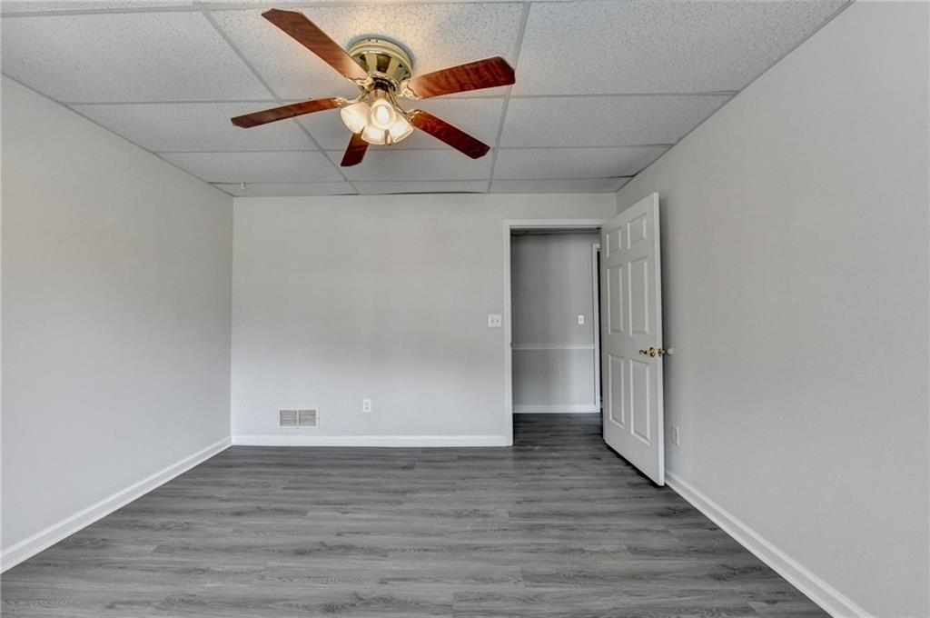 1622 New Hope Road Lawrenceville, GA 30045 - Photo 74 of 110 a view of an empty room with wooden floor