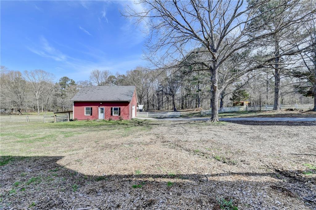 1622 New Hope Road Lawrenceville, GA 30045 - Photo 78 of 110 a view of a yard with a house in the background