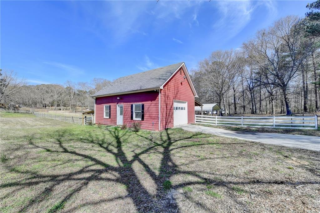 1622 New Hope Road Lawrenceville, GA 30045 - Photo 79 of 110 a view of a house with a yard