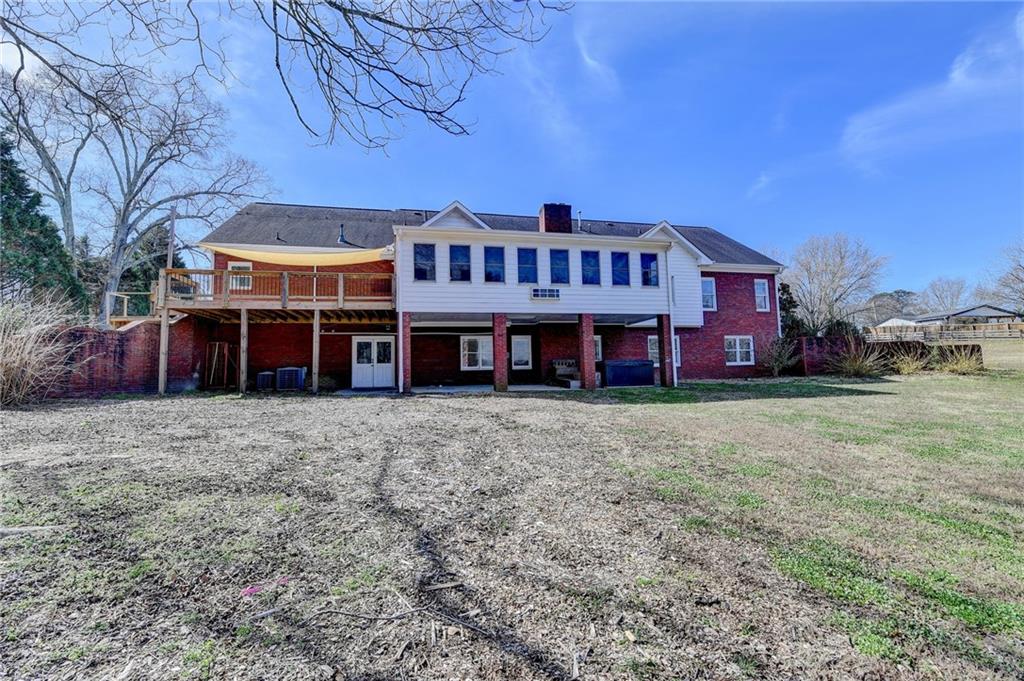 1622 New Hope Road Lawrenceville, GA 30045 - Photo 80 of 110 a front view of a house with a garden