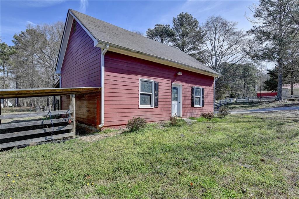 1622 New Hope Road Lawrenceville, GA 30045 - Photo 84 of 110 a view of a house with a yard plants and large tree