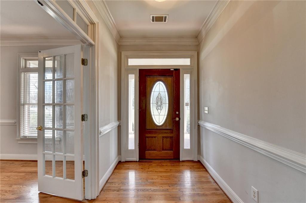 1622 New Hope Road Lawrenceville, GA 30045 - Photo 9 of 110 a view of an entryway with wooden floor and door