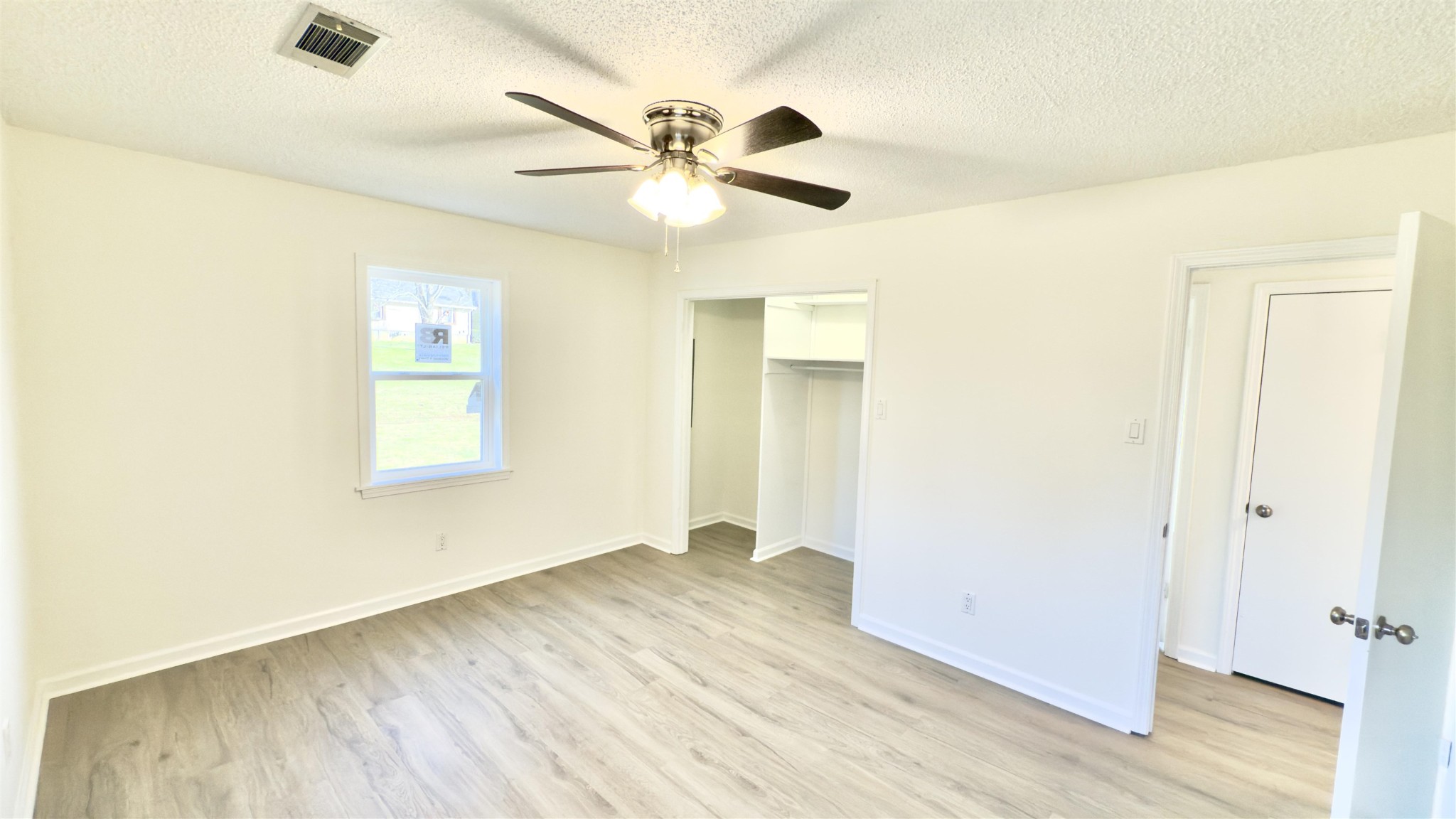 9000 Jack Bond Road Arlington, TN 38002 - Photo 11 of 19 a view of empty room with wooden floor