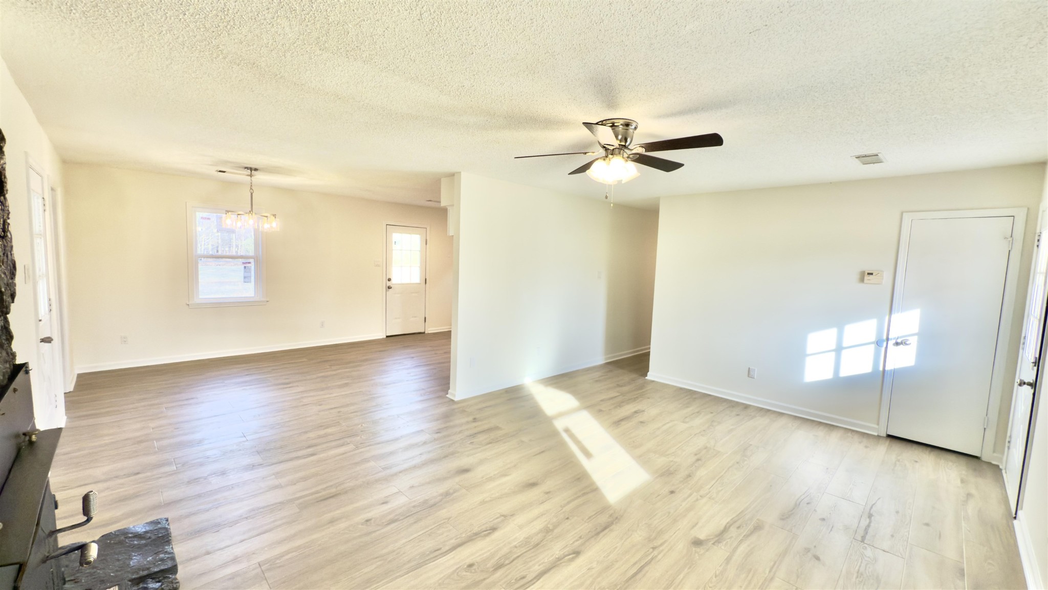 9000 Jack Bond Road Arlington, TN 38002 - Photo 5 of 19 an empty room with wooden floor and windows