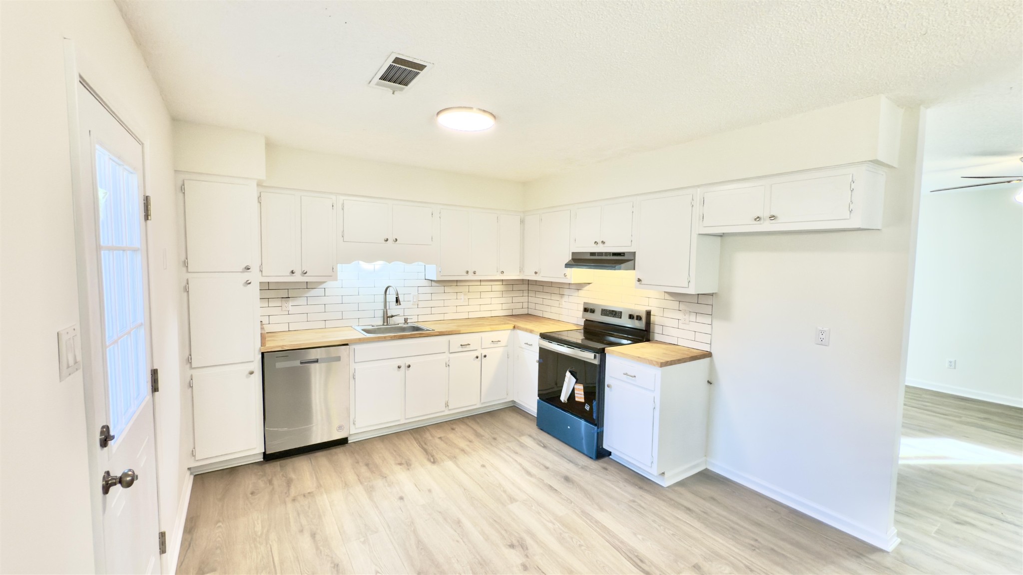 9000 Jack Bond Road Arlington, TN 38002 - Photo 7 of 19 a kitchen with cabinets and wooden floor