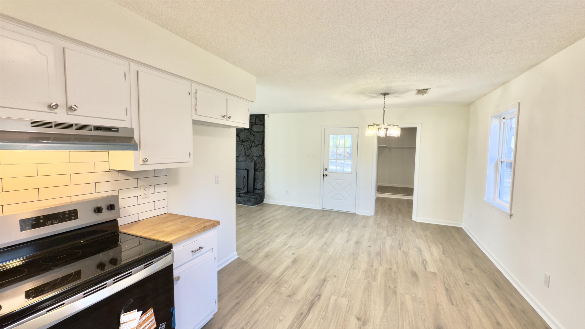 9000 Jack Bond Road Arlington, TN 38002 - Photo 8 of 19 a kitchen with a refrigerator and a stove top oven