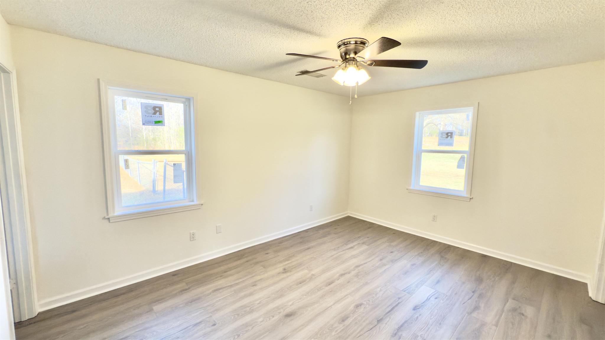 9000 Jack Bond Road Arlington, TN 38002 - Photo 10 of 19 a view of an empty room with wooden floor and a window
