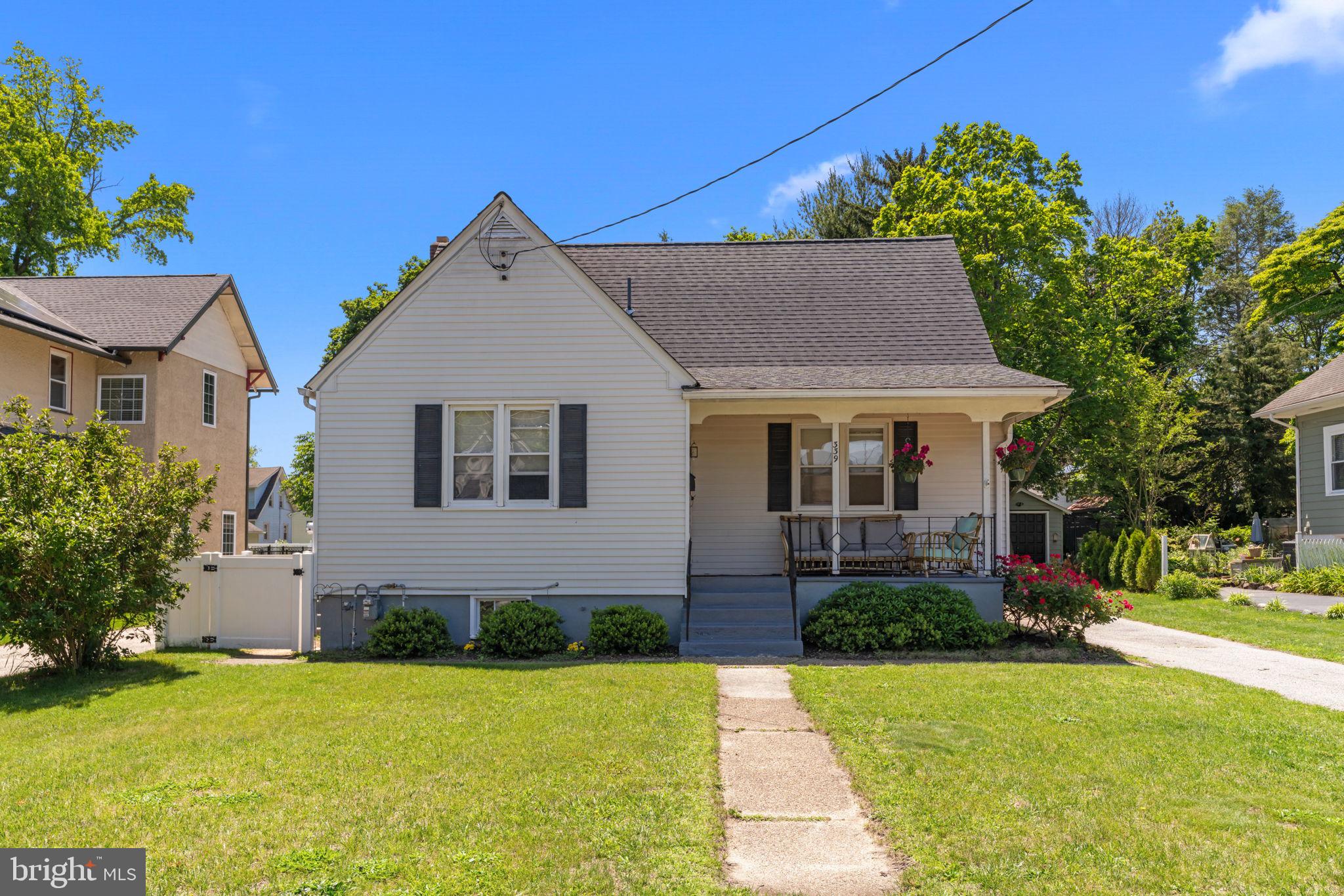 339 Pitman Avenue Pitman, NJ 08071 - Photo 2 of 25 a front view of a house with a yard