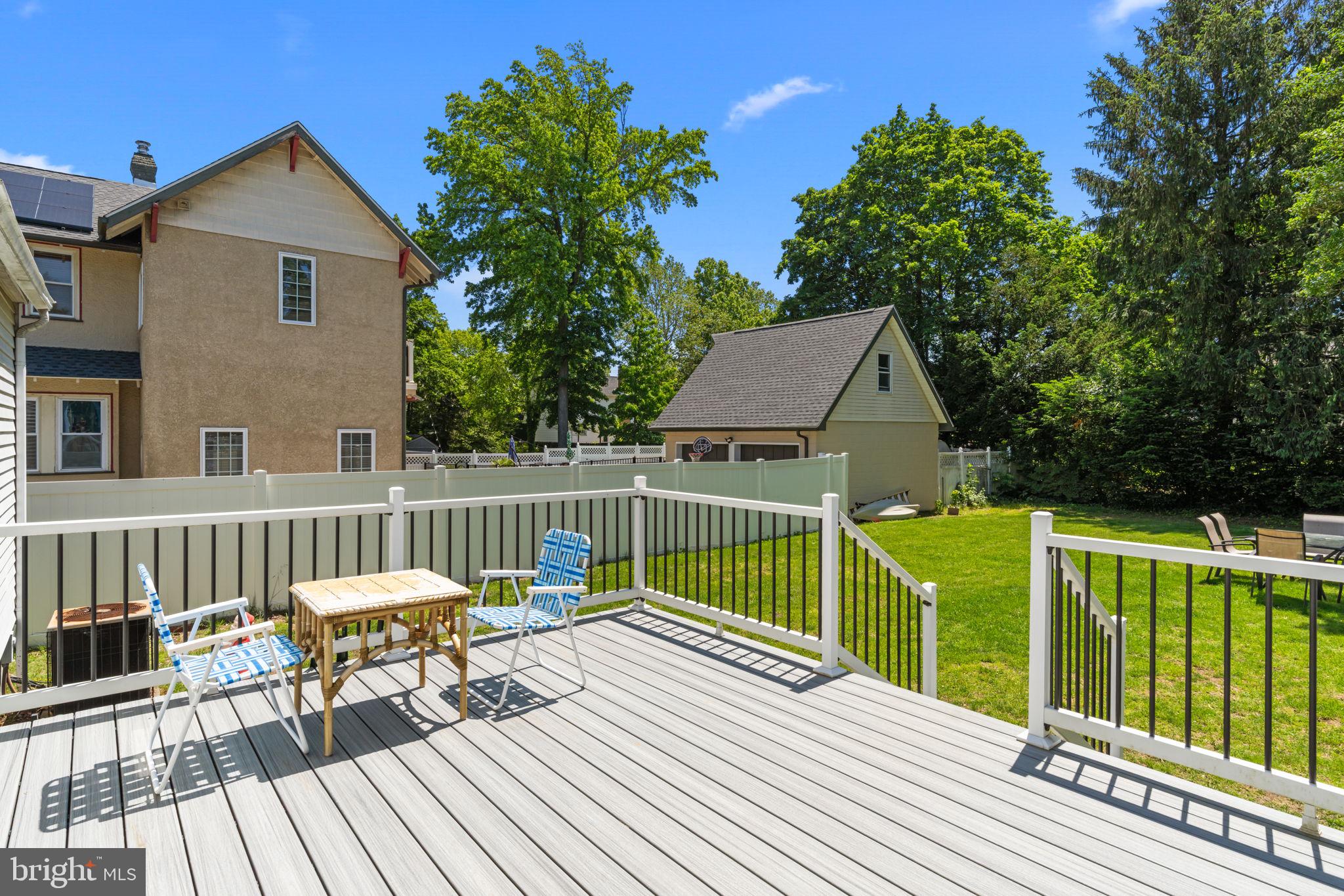339 Pitman Avenue Pitman, NJ 08071 - Photo 22 of 25 a view of a deck with two chairs and wooden fence