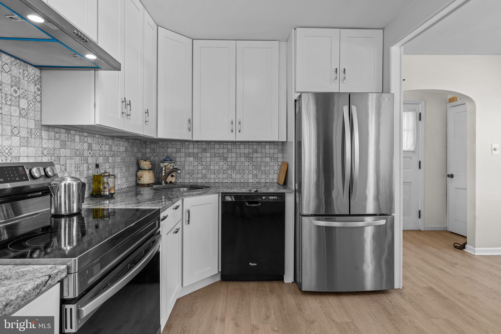 339 Pitman Avenue Pitman, NJ 08071 - Photo 6 of 25 a kitchen with a refrigerator sink and cabinets