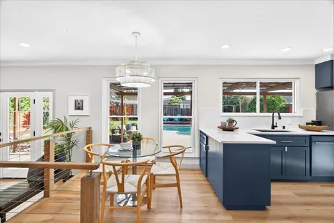a view of a dining room with furniture window and outside view