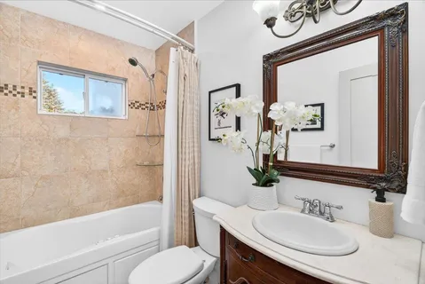 a bathroom with a sink a toilet and a bathtub