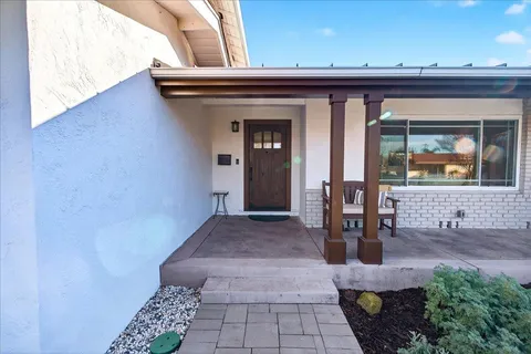 a view of hall way with furniture