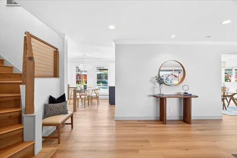 a view of a dining room with furniture window and wooden floor