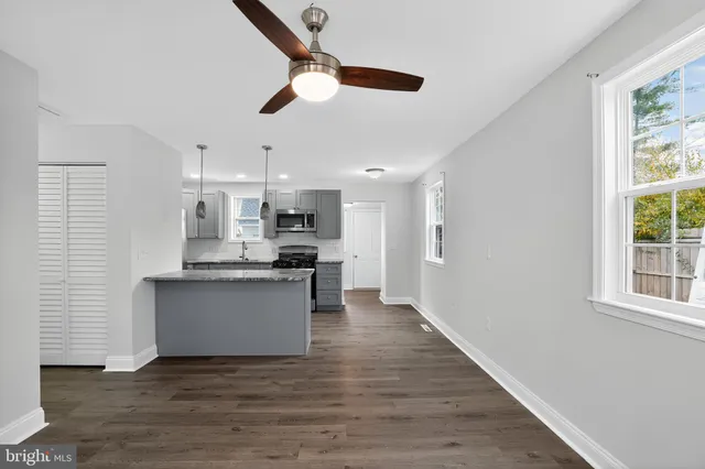 a view of kitchen with wooden floor