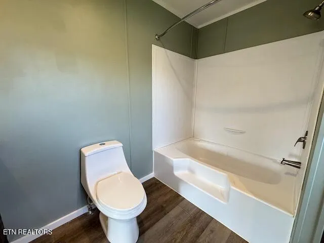 a view of a room with window and wooden floor