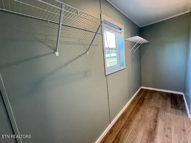 a view of an empty room with a window