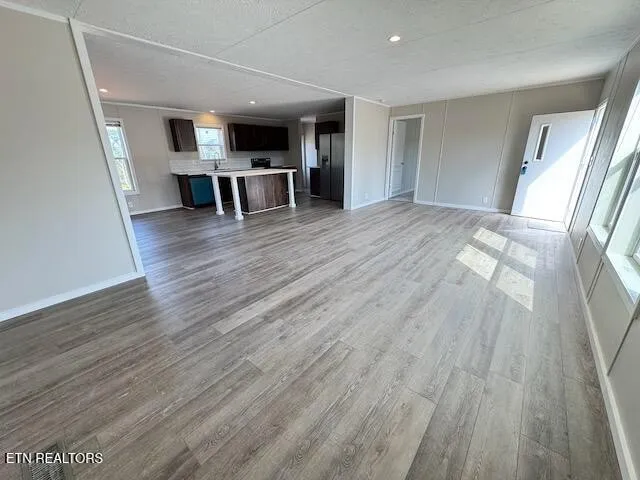 a view of work space with wooden floor and furniture