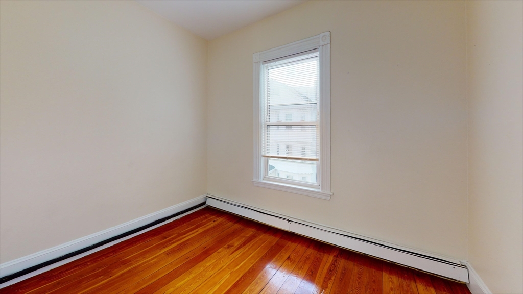 7 Sunset Street, Unit UPPR Boston, MA 02120 - Photo 5 of 7 an empty room with window