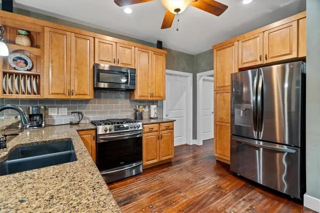 a bedroom with bed and a chandelier