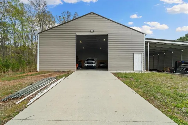 a front view of a house with yard and garage