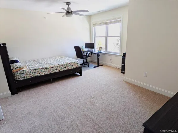 a bedroom with bed and window