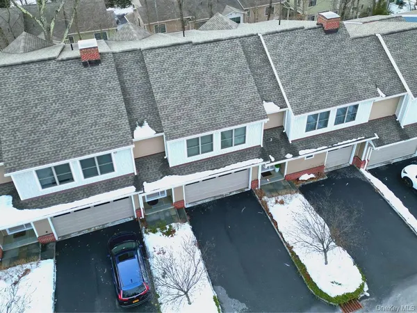 an aerial view of a house with a ocean view