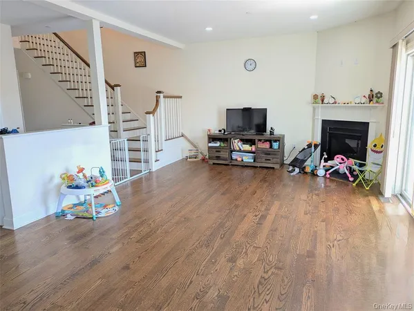 a view of a livingroom with furniture and a flat screen tv