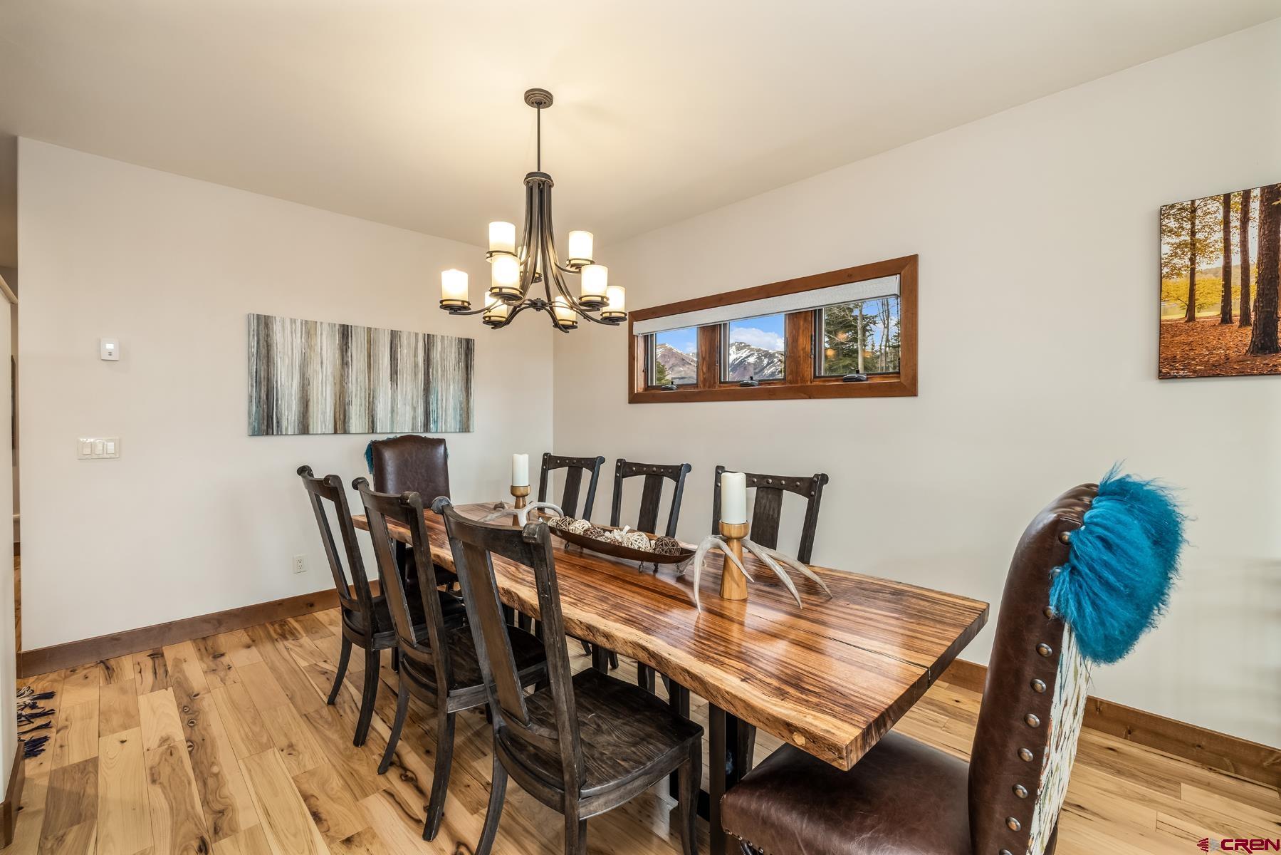32 Cinnamon Mountain Road Crested Butte, CO 81225 - Photo 12 of 44 a view of a dining room with furniture and wooden floor