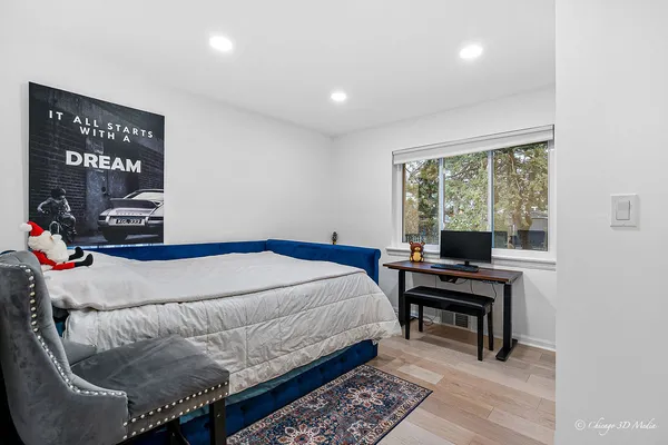 a bedroom with a bed and a window