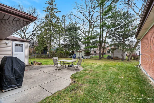 a view of a park with bench and garden