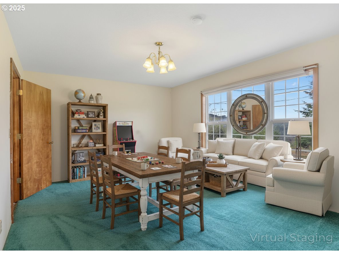37555 Hauger Mountain Lane Seaside, OR 97138 - Photo 15 of 32 a living room with furniture a rug and a window