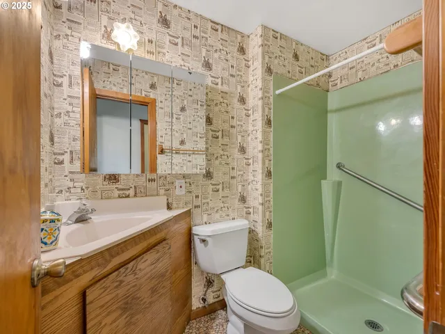 a view of a hallway with wooden floor and stairs