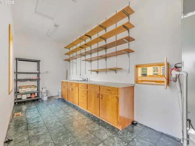 a view of an empty room with floor to ceiling window