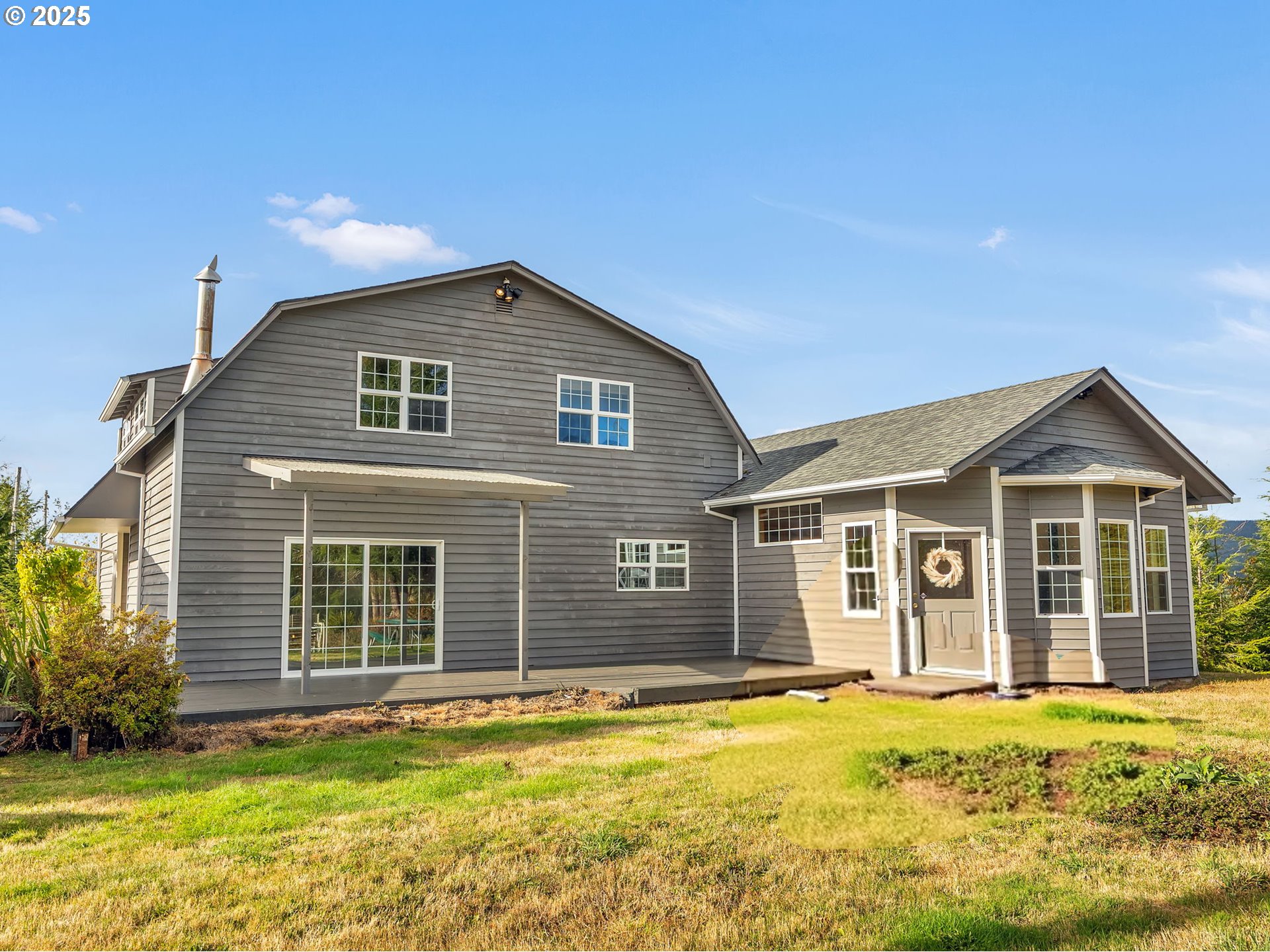 37555 Hauger Mountain Lane Seaside, OR 97138 - Photo 2 of 32 a front view of a house with a yard