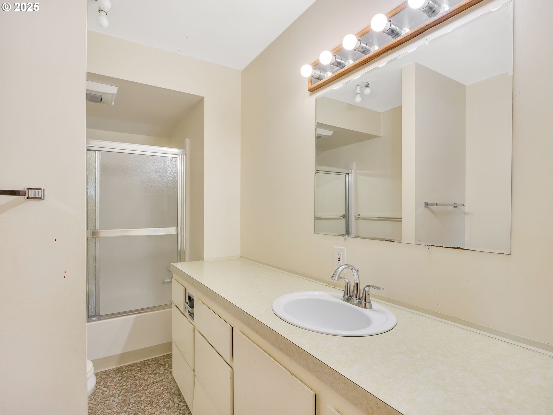 37555 Hauger Mountain Lane Seaside, OR 97138 - Photo 25 of 32 a bathroom with a sink and a mirror