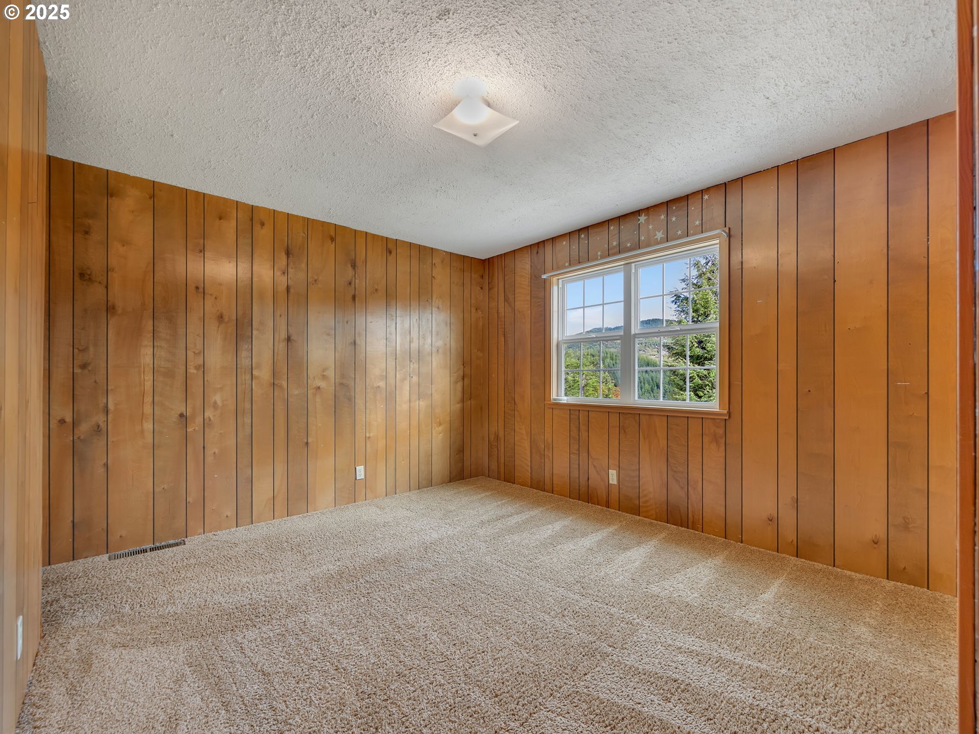 37555 Hauger Mountain Lane Seaside, OR 97138 - Photo 29 of 32 a view of an empty room with a window