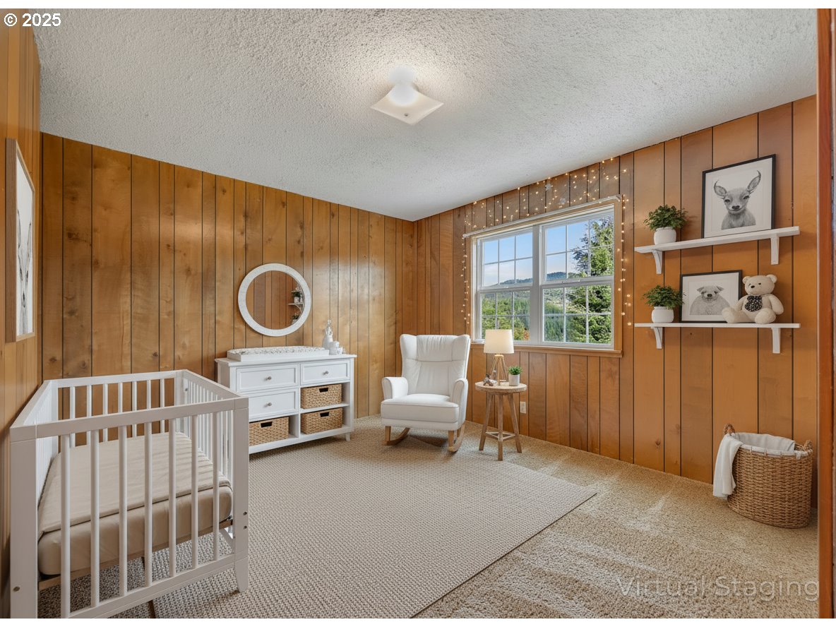 37555 Hauger Mountain Lane Seaside, OR 97138 - Photo 30 of 32 a bedroom with furniture and a large window