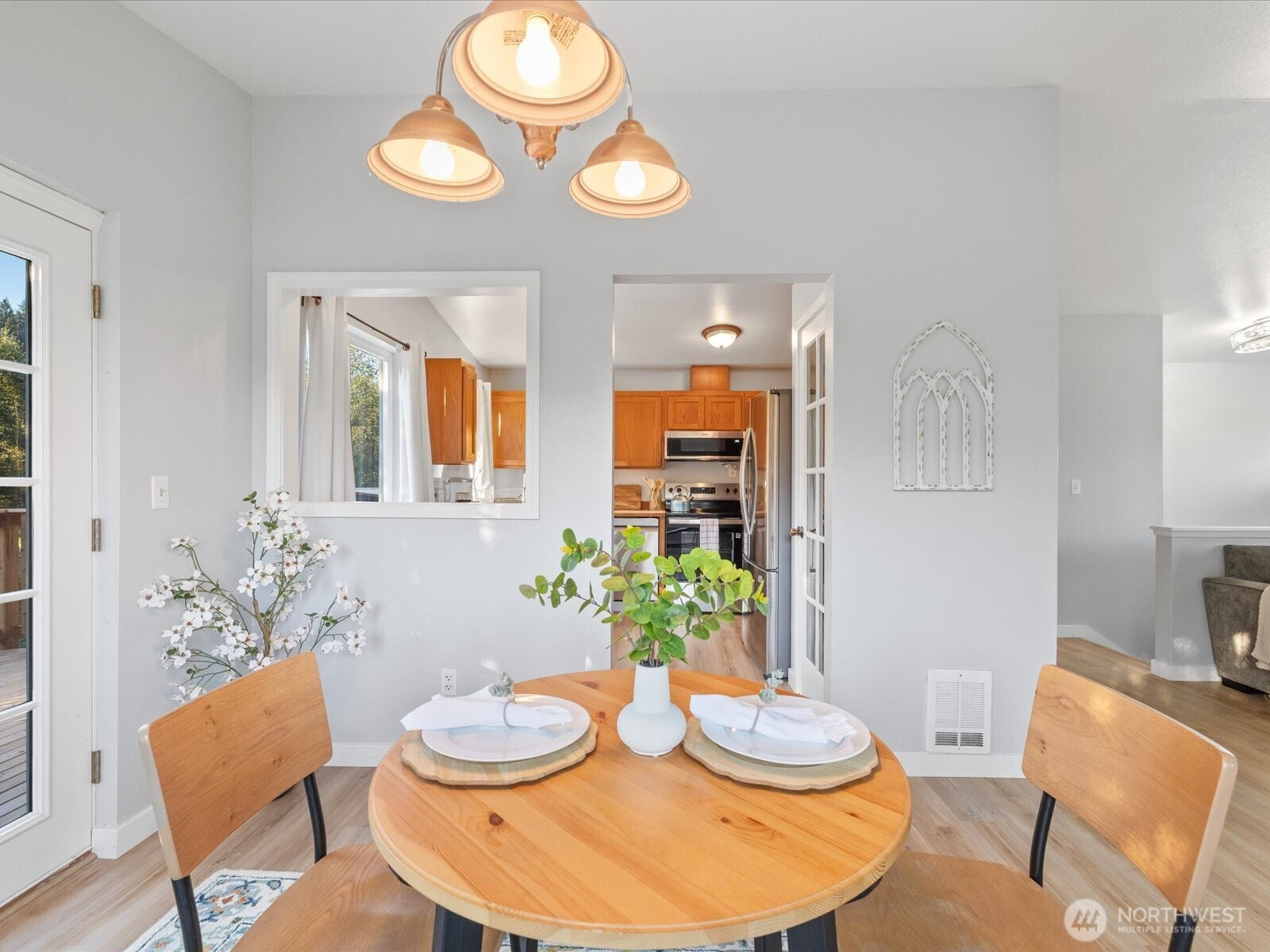 13802 State Rte 530 Northeast Arlington, WA 98223 - Photo 13 of 40 a view of a dining room with furniture and wooden floor