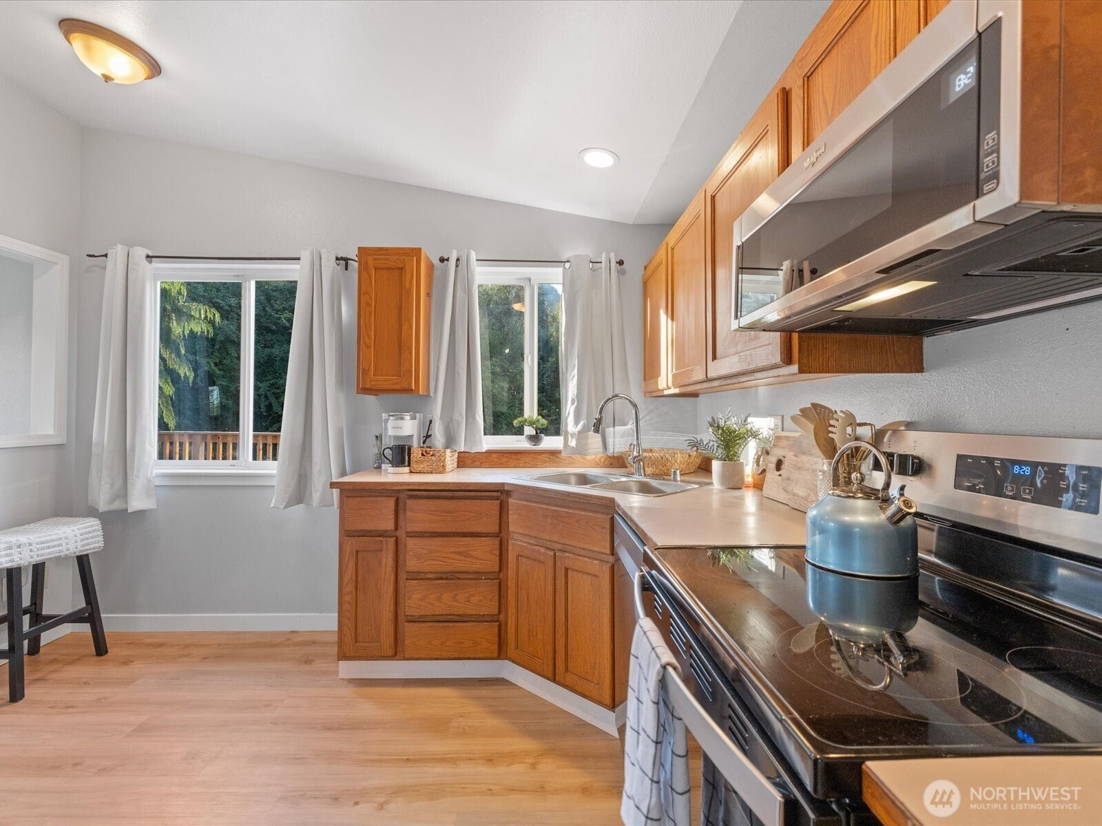 13802 State Rte 530 Northeast Arlington, WA 98223 - Photo 18 of 40 a kitchen with a sink appliances and cabinets