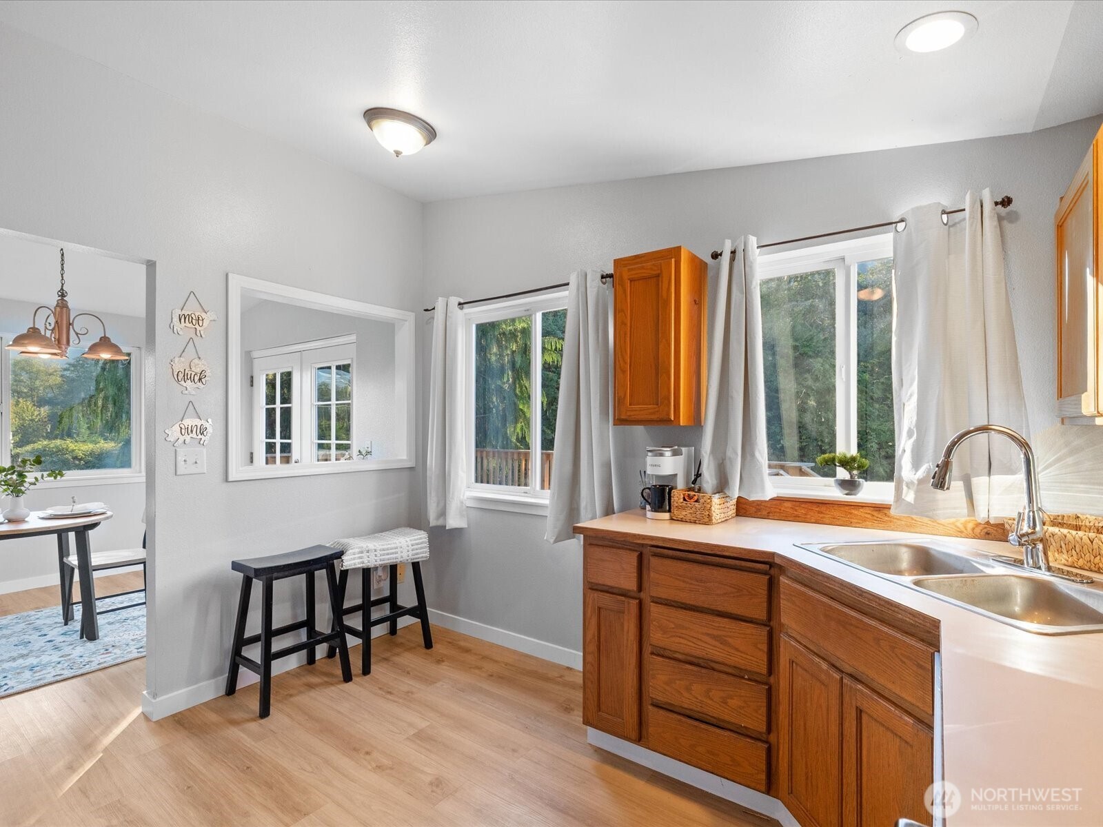 13802 State Rte 530 Northeast Arlington, WA 98223 - Photo 19 of 40 a kitchen with a table chairs sink and cabinets