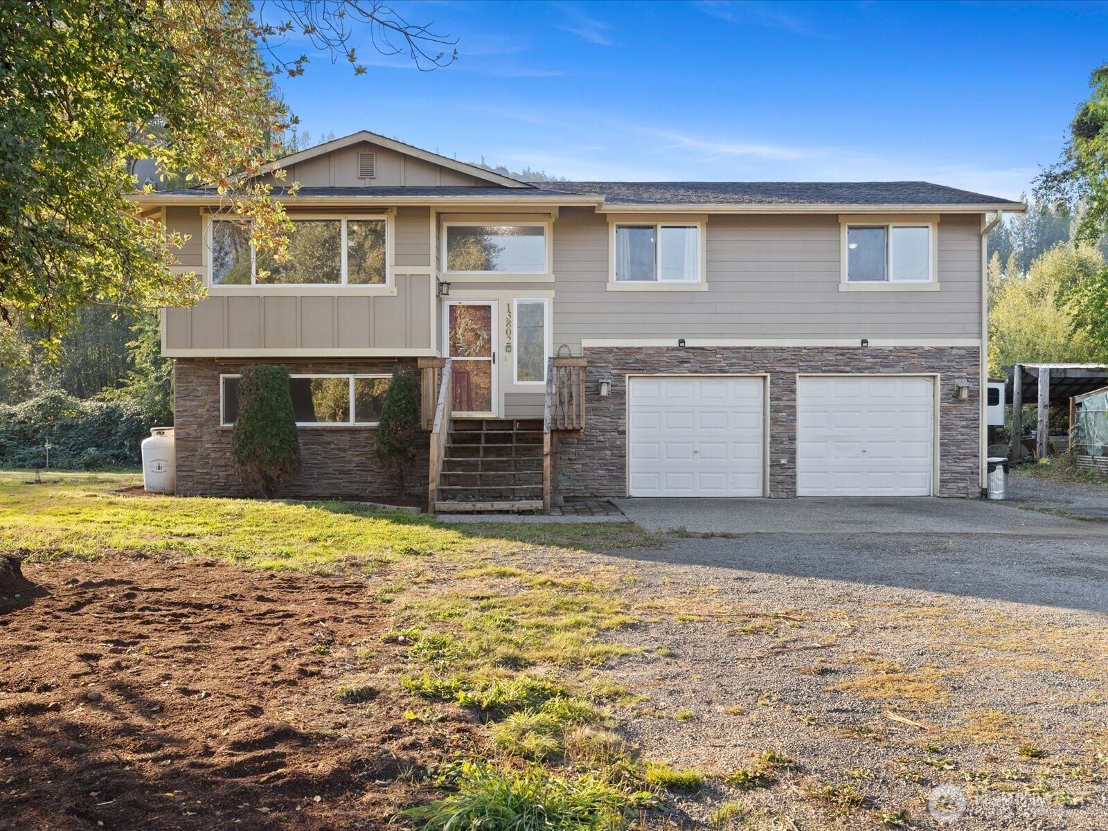 13802 State Rte 530 Northeast Arlington, WA 98223 - Photo 2 of 40 a front view of a house with a yard